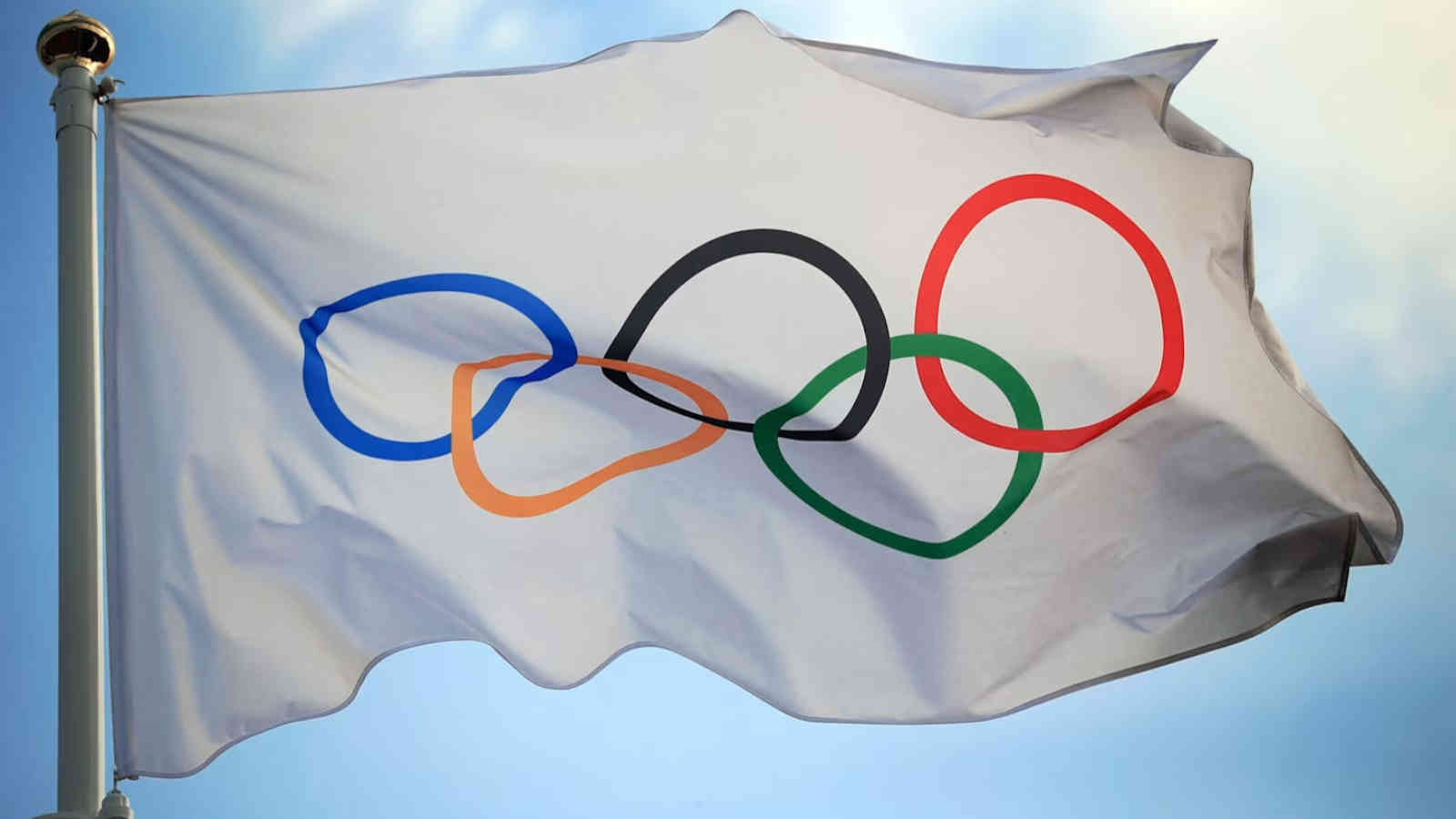 International Olympic flag flying in the wind