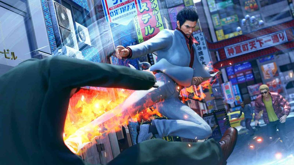 Kazuma Kiryu performing a flying kick on an opponent on the city streets in Yakuza Kiwami 3