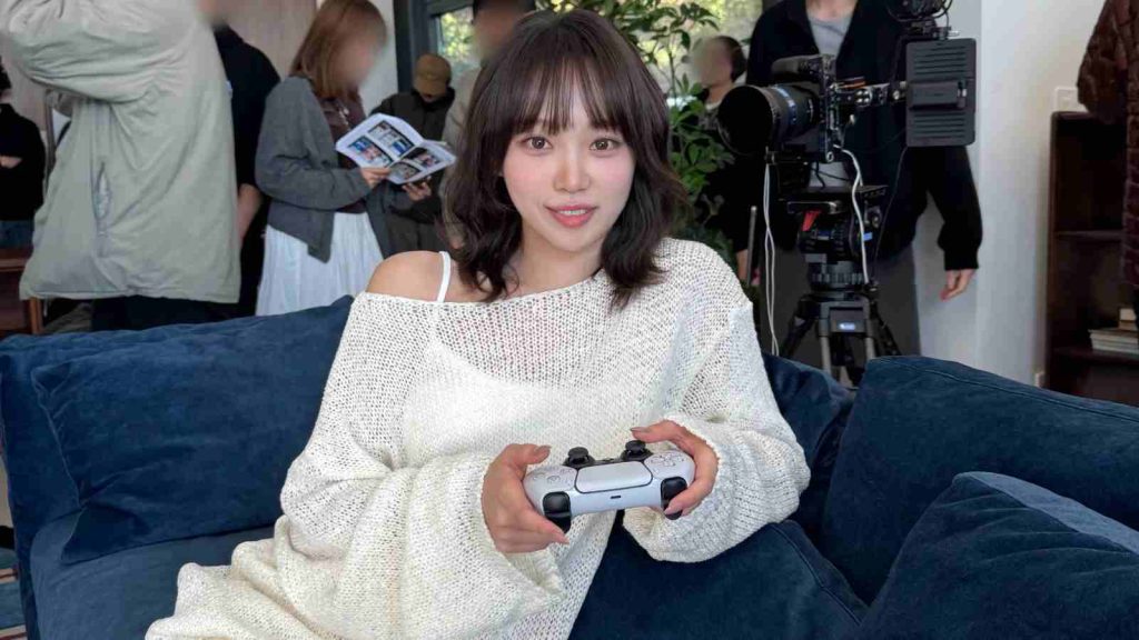 PlayStation x Le Sserafim collaboration: Kim Chaewon holds a PlayStation controller in behind-the-scenes photo