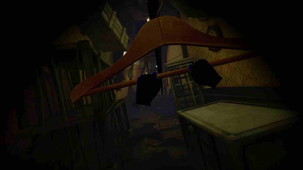 Player grabbing a wooden hanger with both hands in an area with wooden crates in Little Nightmares VR: Altered Echoes official screenshot