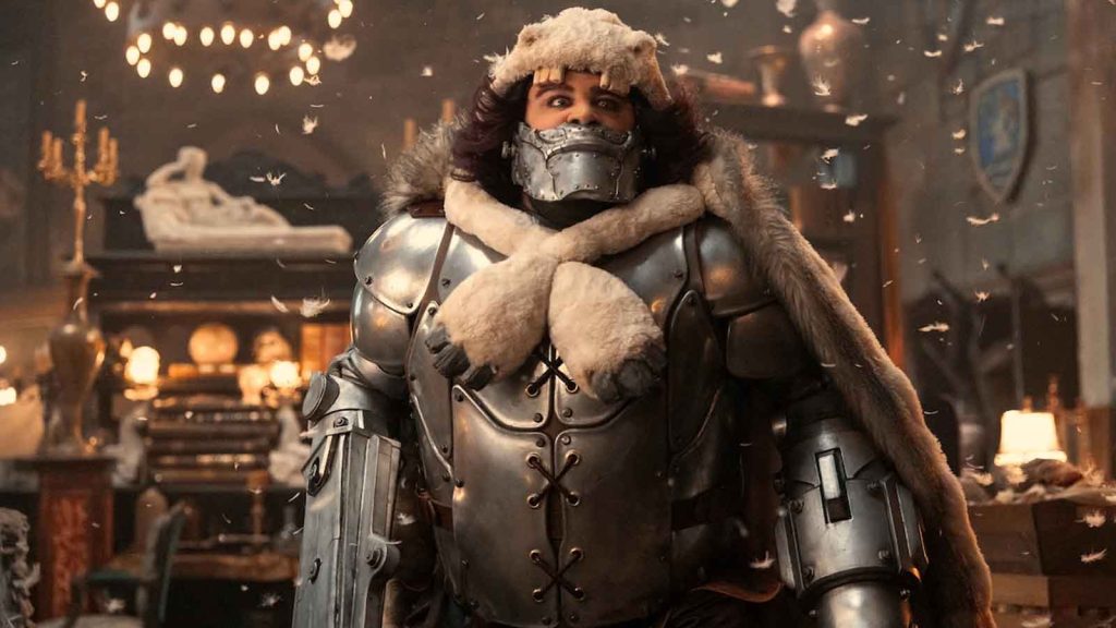 Rob Colletti as King Wapol inside Drum Castle with feathers floating around him in Drum Island in One Piece live action season 2.