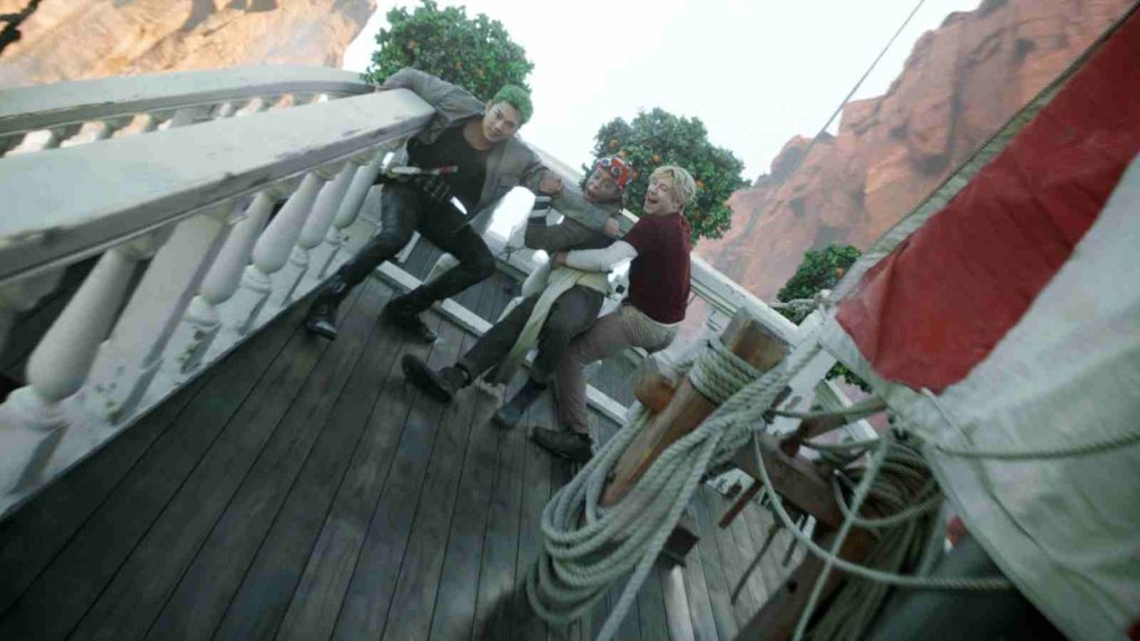 Zoro, Usopp, and Sanji hanging on for dear life on the Go Merry as it goes down Reverse Mountain