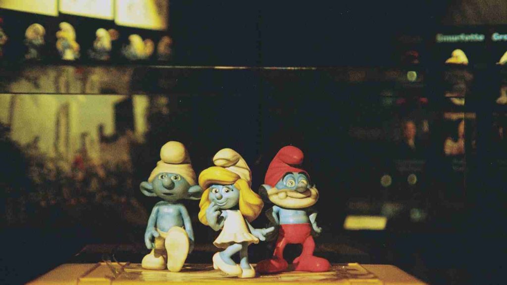 Photograph of three The Smurfs figurines lined up in a row