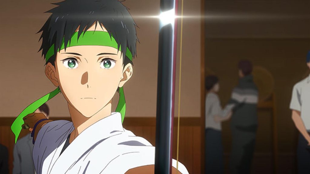 Minato Narumiya holding a bow while wearing a green band on his forehead in the Tsurune anime series.