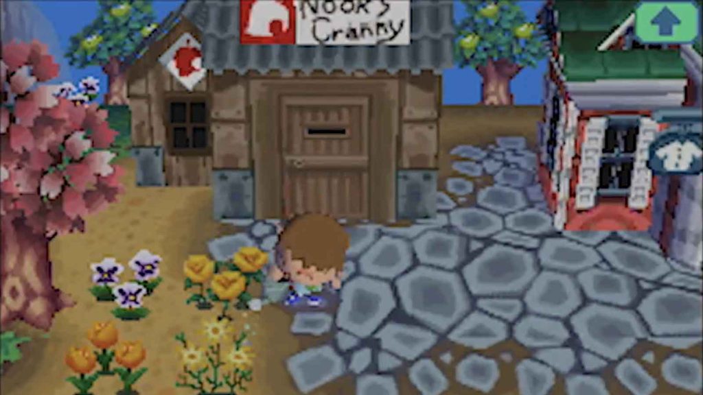 A male character in Animal Crossing: Wild World watering a few flowers in front of Nook's Cranny.