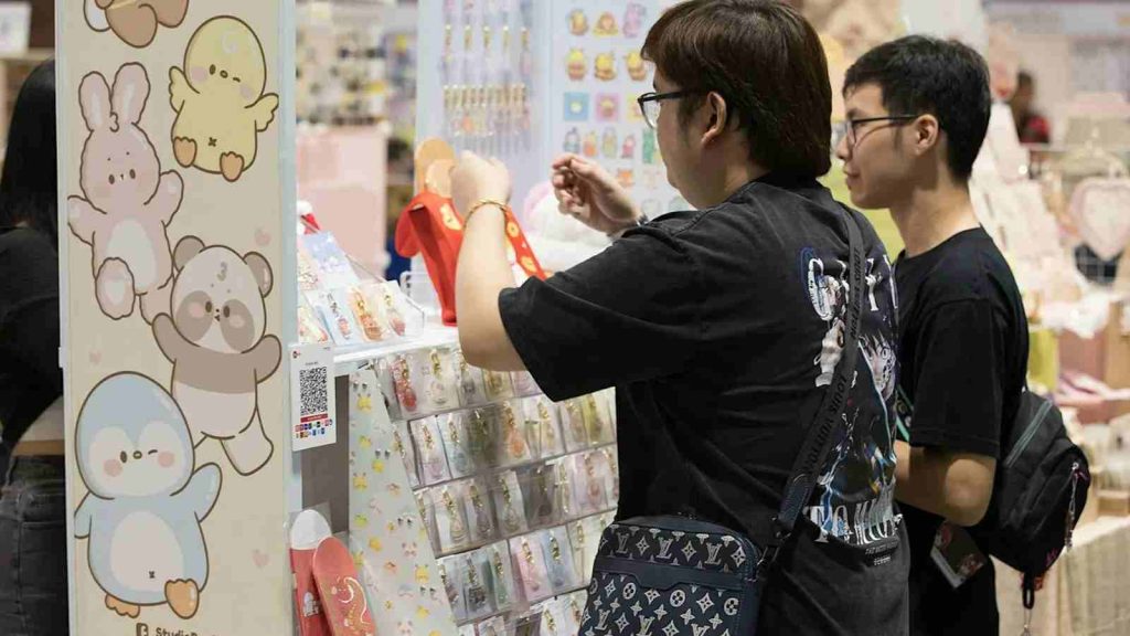 Attendees buying merch from boother at EOY 2025