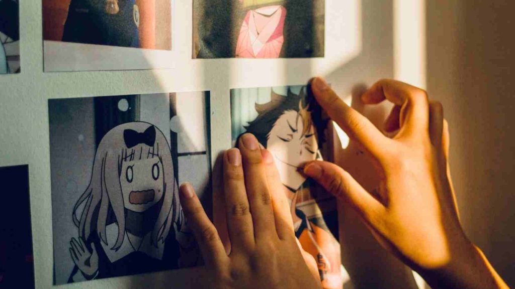 Fan putting up an anime Haikyuu print of Yu Nishinoya on their wall