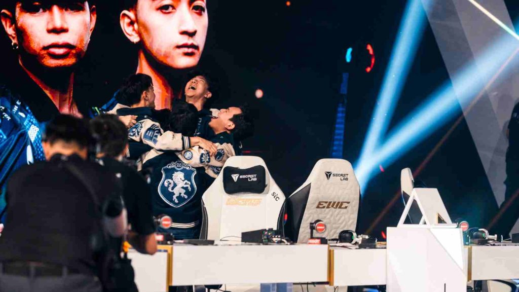 Team Liquid come together for a group hug on stage at MSC 2025 at EWC after winning the grand final