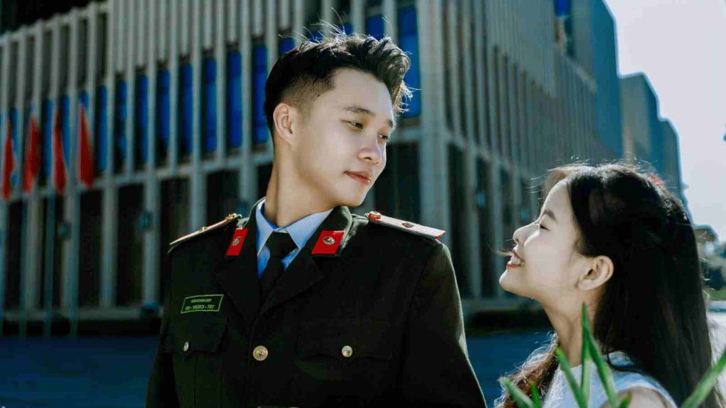 Vietnamese couple looking at each other lovingly 