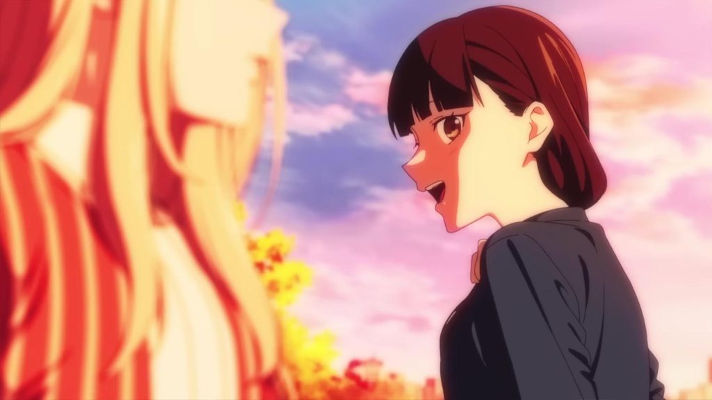 A screenshot from the Young Ladies Don't Play Fighting Games anime teaser PV showing Aya Mitsuki talking to Mio Yorue in the foreground during sunset.