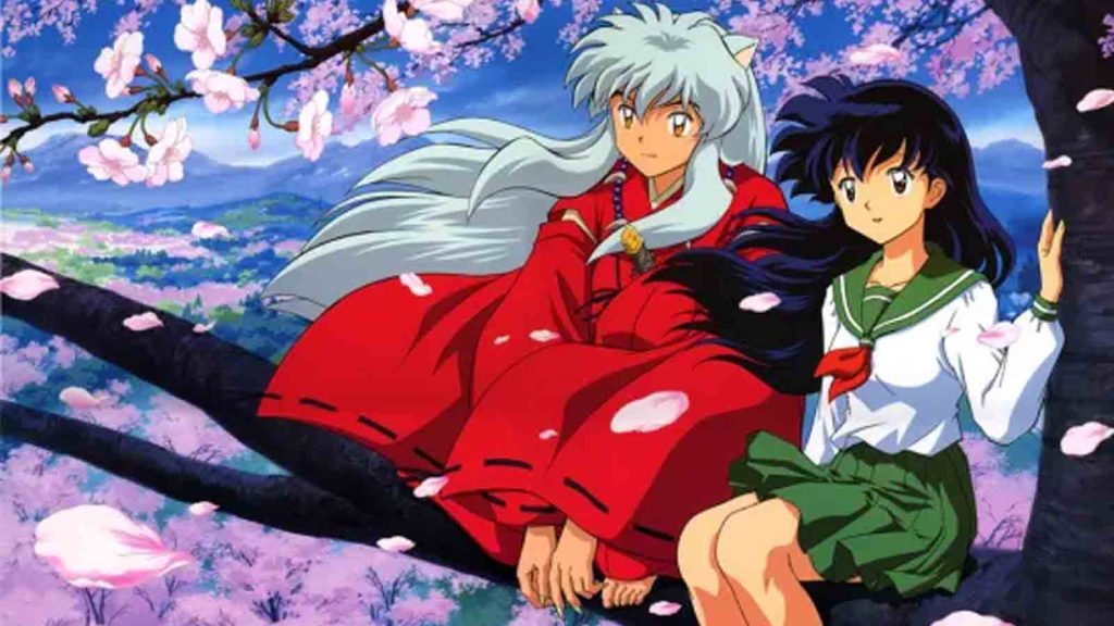 Inuyasha and Kagome Higurashi sitting together on top of a cherry blossom tree.