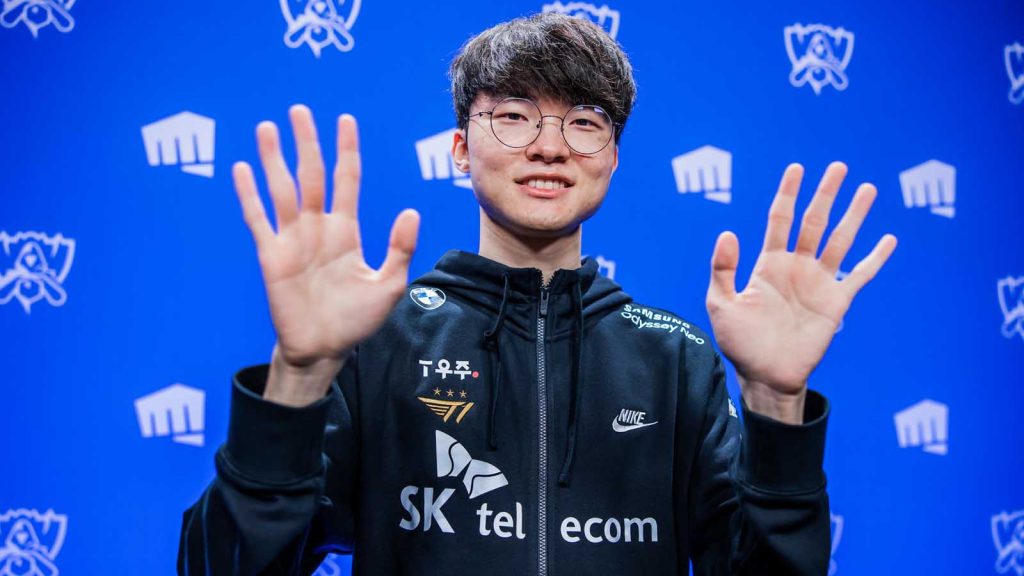 Lee "Faker" Sang-hyeok at the League of Legends World Championship, showing both of his hands.