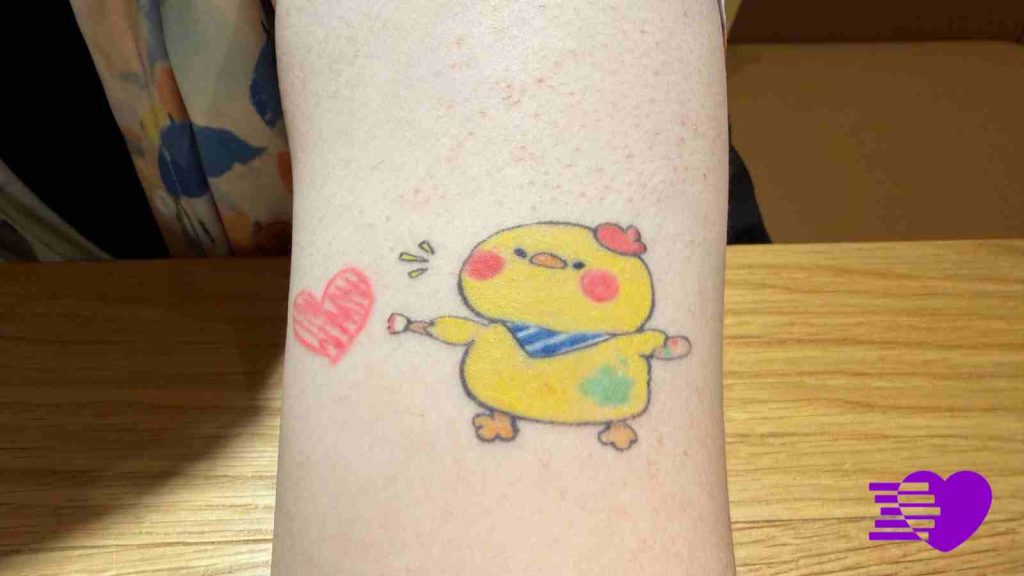 Photograph of Rafayel tattoo of Artsby Birb on Melissa's left arm