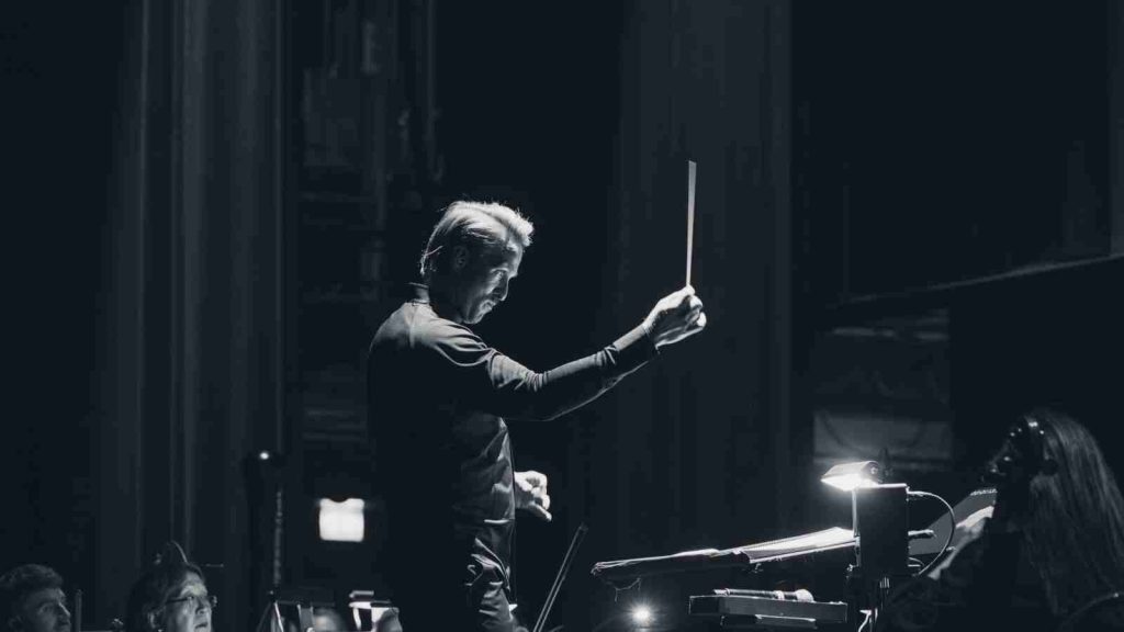 Ludvig Forssell conducting during Death Stranding Strands of Harmony world tour 