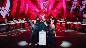 MLBB MWI 2026 champions Team Vitality lifts the trophy on stage in celebration of their victory at EWC 2026