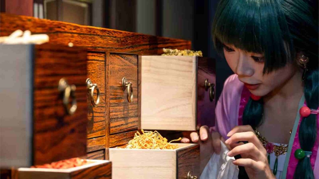 Maomao opening the medicine cabinet in The Apothecary Diaries Exhibition in Singapore