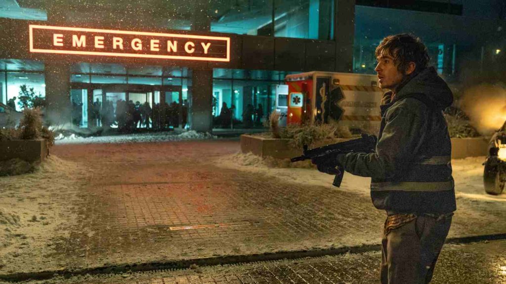 Bryan standing outside Racoon City hospital at the Emergency entrance where the infected are present in Resident Evil 2026 movie