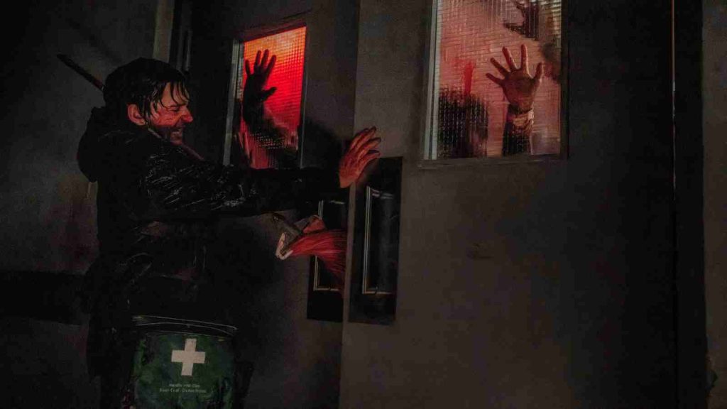 Bryan using a mop to latch the doors of the maternity ward in Racoon City hospital in Resident Evil 2026 movie
